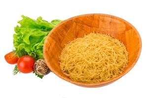 Raw pasta in the bowl photo