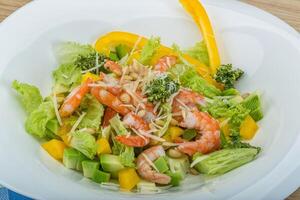 Salad with shrimps and avocado in the bowl photo