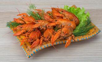 Boiled crayfish in the plate photo