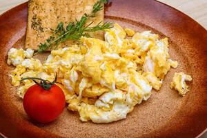 Scrambled eggs with tomato photo