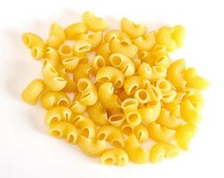 dried italian pasta on white background photo