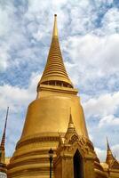 Golden pagoda in Grand Palace Bangkok Thailand photo