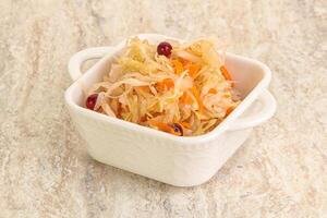 Fermented cabbage - sauerkraut in the bowl photo