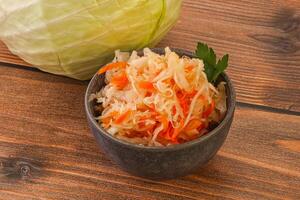 Sauerkraut - pickled cabbage in the bowl photo