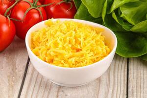 Shredded cheese in the bowl photo