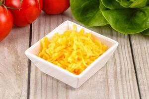 Shredded cheese in the bowl photo