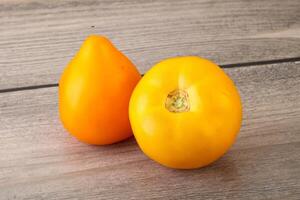 Ripe yellow bright juicy tomato photo