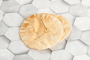 Traditional eastern round pita bread photo