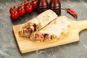 Shawarma with grilled chicken meat photo