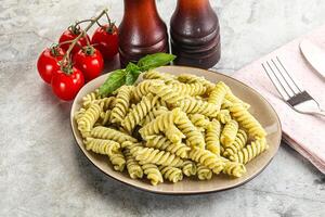 Italian pasta with basil pesto photo