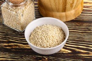 Sesame seeds heap in the bowl photo