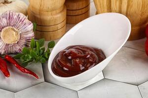 Tasty barbecue sauce in the bowl photo