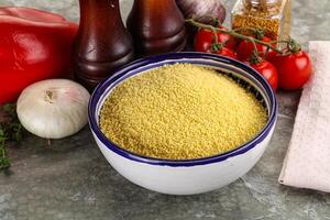 Raw dry wheat couscous grain photo