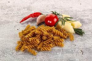 Raw whole grain pasta fusilli photo