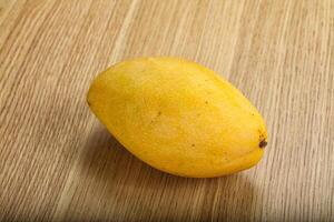 Sweet ripe juicy tropical mango fruit photo