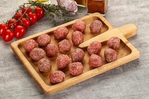 Uncooked raw beef meatball minced photo