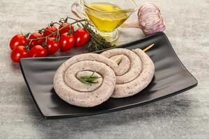 Natural spiral sausage for grill photo