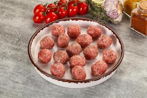 Uncooked raw beef meatball minced photo