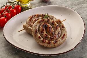 Grilled natural spiral meat sausage photo