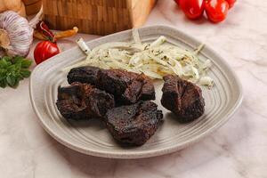 Grilled beef barbecue served onion photo