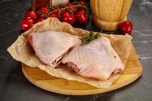 Raw chicken thigh for cooking photo