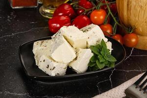 Greek traditional Feta cheese cubes photo