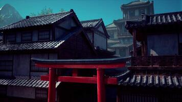 A red gate in front of some buildings video