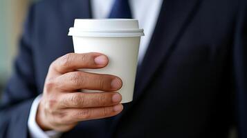 AI generated Close up of businessman s hand holding an empty coffee to go paper cup with a focus on the details photo