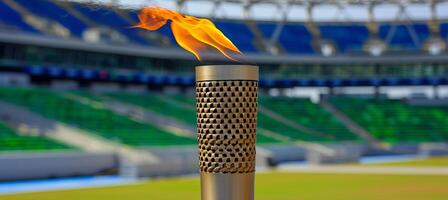 AI generated Olympic torch flame burning against blurred sports arena with copy space for text placement photo