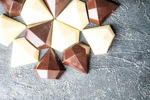 Assorted Chocolates Piled on Table photo