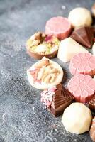 Assorted Chocolate Types Displayed on Table photo