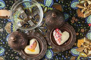 Two Heart Shaped Pastries on Tray photo