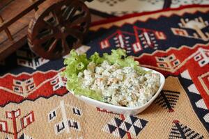 Small Bowl of Food on Rug photo