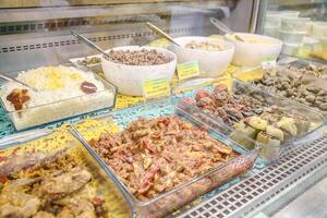 Varied Assortment of Food Items in a Display Case photo