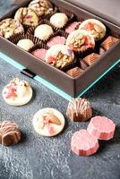 Assorted Chocolates in a Box on a Table photo