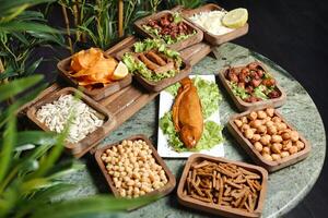 Diverse Spread of Various Foods on Table photo