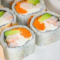 Close Up of Assorted Sushi Rolls on a Plate photo