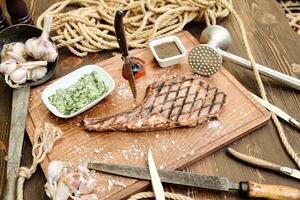 Wooden Cutting Board With Assorted Meats and Vegetables photo