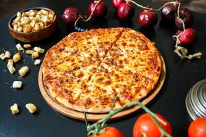 Pepperoni Pizza on Wooden Cutting Board photo