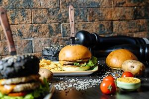 Two Burgers With Lettuce on a Table photo