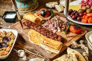 Wooden Table Displaying Assorted Types of Food photo