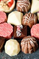 Assorted Types of Chocolates Spread on a Table photo