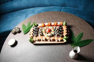 Wooden Table With a Tray of Sushi photo