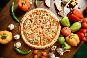 Pizza on Wooden Cutting Board photo