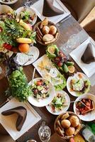 Abundance of Plates of Food on a Table photo