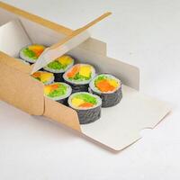 Cardboard Box Filled With Sushi on White Table photo