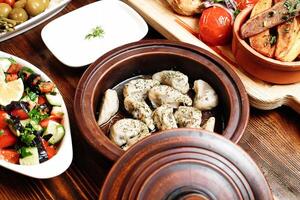 Wooden Table Displaying Various Types of Food photo