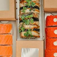 Assorted Sushi Box on Table photo