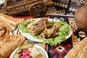 Table With Plates of Food on Rug photo