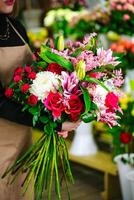 Woman Holding Bouquet of Flowers photo